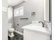 Modern bathroom features a stylish vanity, black and white tiles, and a minimalist design at 748 W 100Th Ave, Northglenn, CO 80260