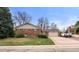 Charming brick ranch-style home with a well-manicured lawn and a two car garage at 748 W 100Th Ave, Northglenn, CO 80260
