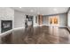 Spacious open-concept living area with hardwood floors, fireplace, and kitchen views at 748 W 100Th Ave, Northglenn, CO 80260