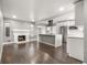 Spacious living room and kitchen area with hardwood floors and modern stainless steel appliances at 748 W 100Th Ave, Northglenn, CO 80260