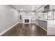 Open-concept living area features a fireplace and connects seamlessly with the modern kitchen at 748 W 100Th Ave, Northglenn, CO 80260