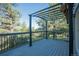 Enjoy outdoor living on this deck with metal pergola and scenic tree view at 9212 Tanglewood Rd, Franktown, CO 80116