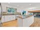 Beautiful kitchen featuring white cabinets, stainless appliances, and an island with granite counters at 9212 Tanglewood Rd, Franktown, CO 80116