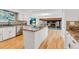 Beautiful kitchen featuring white cabinets, stainless appliances, and an island with granite counters at 9212 Tanglewood Rd, Franktown, CO 80116