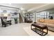 Basement with comfortable seating, decor and staircase at 22310 E Chenango Dr, Aurora, CO 80015