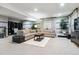 Finished basement with plush carpeting, comfortable sofas, and stylish decor at 22310 E Chenango Dr, Aurora, CO 80015