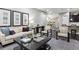 Spacious living room with contemporary decor, comfortable seating, and lots of natural light at 22310 E Chenango Dr, Aurora, CO 80015