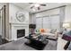 Cozy living room with a fireplace, large windows, and comfortable seating at 22310 E Chenango Dr, Aurora, CO 80015