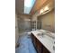 Bathroom features vanity, shower-tub and skylight offering natural light at 5151 S Laredo Ct, Centennial, CO 80015