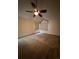 Bright and airy bedroom featuring large windows, plush carpet, and a ceiling fan at 5151 S Laredo Ct, Centennial, CO 80015