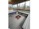 Covered patio on deck with built-in benches and fire pit, ideal for outdoor living and gatherings at 5151 S Laredo Ct, Centennial, CO 80015