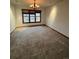 Bright dining room featuring neutral carpet and a large window, creating an inviting space for meals at 5151 S Laredo Ct, Centennial, CO 80015