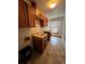 Functional laundry room boasts tile floor, storage cabinets, utility sink and window for ample natural light at 5151 S Laredo Ct, Centennial, CO 80015