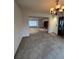 Spacious living room showcasing neutral carpet, seamlessly connecting to other areas of the home for versatile living at 5151 S Laredo Ct, Centennial, CO 80015