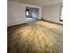 Bright living room featuring neutral carpet and a large opening to the adjacent room, creating an open-concept living space at 5151 S Laredo Ct, Centennial, CO 80015