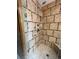 Custom tiled shower with handheld shower fixture and integrated shower niche at 5151 S Laredo Ct, Centennial, CO 80015