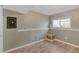 Basement area featuring light gray walls, wood-look flooring, and a window for natural light at 9605 W David Ave, Littleton, CO 80128