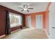 Bedroom featuring two closets, large window, neutral color scheme, and wood flooring at 9605 W David Ave, Littleton, CO 80128