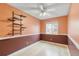 Bedroom featuring a decorative shelf, ceiling fan, neutral colors, and wood flooring at 9605 W David Ave, Littleton, CO 80128