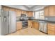 Bright kitchen with stainless steel appliances, wooden cabinets, and a double oven at 9605 W David Ave, Littleton, CO 80128