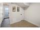 Basement with gray flooring, white walls and doors, decorated with artwork at 25 S Washington St # 2, Denver, CO 80209