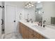 Elegant bathroom featuring a double sink vanity, well-lit mirror, and modern fixtures for a luxurious feel at 25 S Washington St # 2, Denver, CO 80209