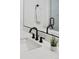 Modern bathroom vanity with quartz countertop and black faucet and fixtures at 25 S Washington St # 2, Denver, CO 80209
