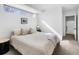 Well-lit bedroom featuring a wide window, neutral tones, and a modern side table enhancing the room's appeal at 25 S Washington St # 2, Denver, CO 80209