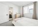 Serene bedroom with a connecting bathroom, features a well-lit vanity area and a bright, airy atmosphere at 25 S Washington St # 2, Denver, CO 80209