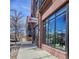 Contemporary brick building with large windows, showcasing thriving businesses at 25 S Washington St # 2, Denver, CO 80209