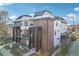 Modern townhome complex featuring brick accents, balconies, and a shared courtyard at 25 S Washington St # 2, Denver, CO 80209