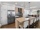 Modern kitchen featuring stainless steel appliances, stylish cabinetry, and a large island with seating at 25 S Washington St # 2, Denver, CO 80209