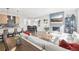 Open-concept living area featuring modern decor, a sleek fireplace, and a dining space with ample natural light at 25 S Washington St # 2, Denver, CO 80209