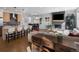 Open floor plan featuring modern kitchen, dining area, and comfortable living room with a fireplace at 25 S Washington St # 2, Denver, CO 80209