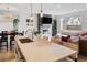 Open floor plan featuring a modern kitchen island, dining area, and a living room with natural light at 25 S Washington St # 2, Denver, CO 80209