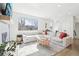 Bright living room featuring a large sectional sofa, modern decor, and a large window with natural light at 25 S Washington St # 2, Denver, CO 80209