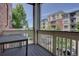 Relaxing balcony with table and railings offers community views at 9520 Halstead, Lone Tree, CO 80124