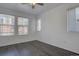 This bedroom boasts a ceiling fan, natural light, and hardwood flooring at 9520 Halstead, Lone Tree, CO 80124