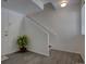 Bright entryway with wood-look tile flooring and staircase access at 9520 Halstead, Lone Tree, CO 80124