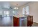 Open-concept kitchen with stainless steel appliances, granite counters, and island at 9520 Halstead, Lone Tree, CO 80124