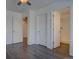 Spacious main bedroom with doorways to the closet and bathroom featuring hardwood floors at 9520 Halstead, Lone Tree, CO 80124