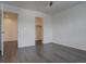 Bright main bedroom with hardwood floors and doorways to the closet and bathroom at 9520 Halstead, Lone Tree, CO 80124