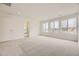 Spacious main bedroom with neutral carpet, a walk-in closet and lots of natural light at 7308 Waterleaf Trl, Littleton, CO 80125