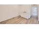 Clean mud room featuring wood-look floors, white cabinets, and a sink for convenient clean-up at 7308 Waterleaf Trl, Littleton, CO 80125