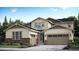 Charming two-story home with a large two car garage and stone accents near the front door at 14553 Hudson Way, Thornton, CO 80602
