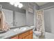 Functional bathroom with a single sink vanity, shower and tub combination, and ample lighting at 8481 W Union Ave # 13203, Denver, CO 80123