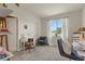Bedroom area featuring a desk, chair, and a window that brings in natural light, enhancing the inviting atmosphere at 8481 W Union Ave # 13203, Denver, CO 80123