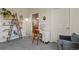 Bright bedroom with stylish shelving and a cozy chair, offering a tranquil and functional space at 8481 W Union Ave # 13203, Denver, CO 80123