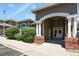 Inviting building exterior with stone pillars and landscaped bushes, creating a welcoming entrance at 8481 W Union Ave # 13203, Denver, CO 80123
