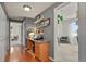 Hallway area featuring a built-in counter/cabinet with hardwood flooring at 8481 W Union Ave # 13203, Denver, CO 80123